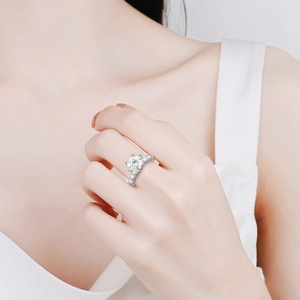 Classic 925 sterling silver ring with 2-carat moissanite stone shown on model's hand