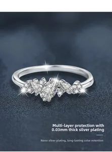 Macro detail of silver ring with marquise moissanite stones and 0.03mm plating