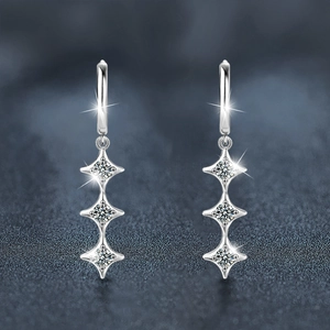 Elegant 925 sterling silver star fringe earrings with moissanite stones on blue background