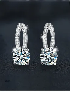 Close-up of 925 silver moissanite earrings with 3EX round cut and 58 facets
