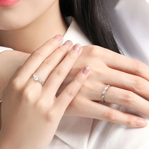S925 sterling silver moissanite twist rings shown on hands with white shirt background