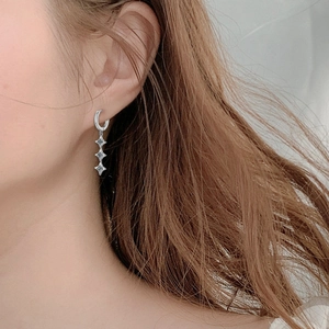 Elegant 925 sterling silver moissanite star tassel drop earrings shown on model