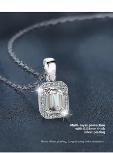 Macro view of S925 silver necklace with emerald-cut moissanite and halo stones