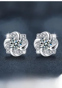Detail of S925 sterling silver windmill studs with moissanite stones and brilliant fire