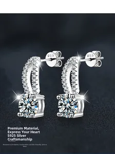 Macro shot of S925 sterling silver earrings showing the 925 hallmark and sparkling moissanite