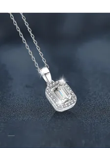 Macro shot of S925 sterling silver necklace featuring an emerald-cut moissanite pendant