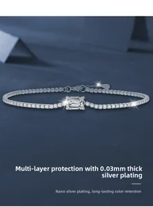 Macro shot of silver tennis bracelet with emerald-cut moissanite and nano-plating