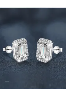 Close-up of emerald-cut moissanite stud earrings in S925 sterling silver halo setting