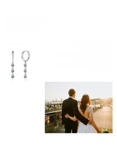 Detailed close-up of S925 silver moissanite tassel earrings with triple vertical stones