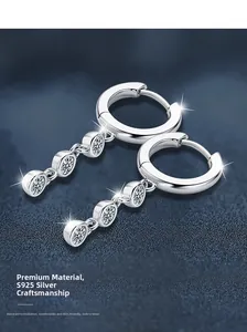 Detailed view of S925 sterling silver tassel earrings with three moissanite stones
