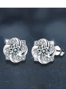 Macro shot of S925 sterling silver stud earrings with a central moissanite stone