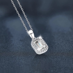 Square moissanite pendant in S925 sterling silver with halo setting on blue background