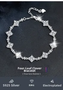 Macro view of S925 silver clover bracelet featuring brilliant moissanite stones and lobster clasp