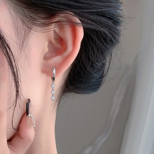 925 sterling silver tassel earrings featuring three graduated round moissanite stones