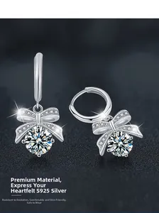 Détail des boucles d'oreilles nœud en argent S925 avec moissanite et pierre principale