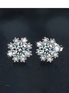 Detailed view of S925 sterling silver snowflake stud earrings with sparkling white stones