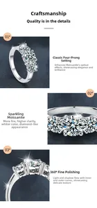 Macro view of three-stone moissanite ring with four-prong setting and polished silver finish