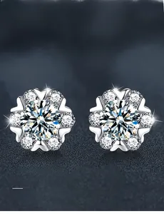 Macro shot of S925 silver snowflake earrings featuring 3EX cut moissanite stones