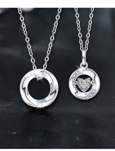 Macro detail of S925 silver Mobius pendant and heart-shaped moissanite with 58 facets