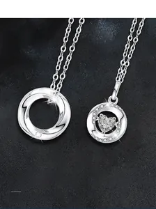 Detailed close-up of S925 sterling silver Möbius necklaces with heart-shaped stone