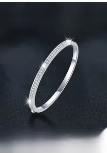 Detail view of S925 sterling silver bangle featuring sparkling moissanite pavé stones