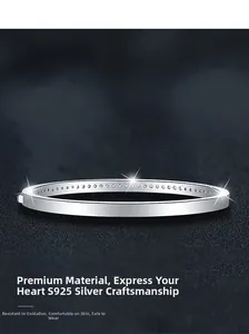 Close-up of S925 sterling silver bangle with pavé moissanite stones and polished finish