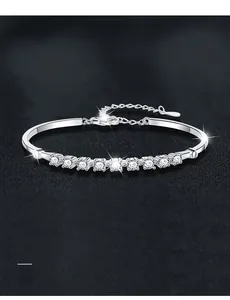 Detailed macro view of 3EX cut moissanite row setting on adjustable S925 silver bracelet