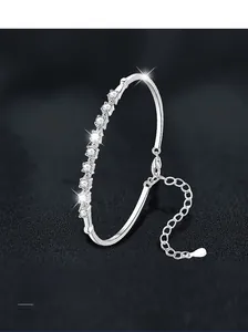 Detailed close-up of S925 sterling silver bangle featuring nine sparkling moissanite stones