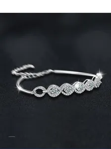 Close-up of S925 sterling silver bracelet with marquise clusters and sparkling gems
