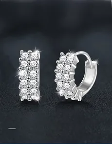 Detailed macro view of S925 sterling silver hoop earrings with double row moissanite stones