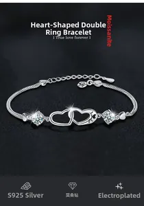 Macro detail of S925 silver double heart bracelet featuring sparkling moissanite gems