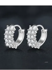 Detailed macro view of S925 sterling silver hoop earrings with triple row pave moissanite