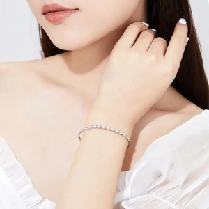 Minimalist S925 sterling silver moissanite row diamond bangle on a female wrist
