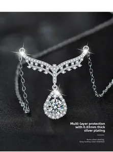 Macro view of S925 sterling silver angel wing necklace with moissanite drop pendant
