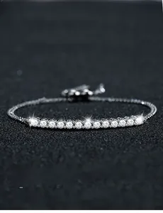 Macro detail of s925 silver smile bracelet featuring 3EX cut moissanite stones