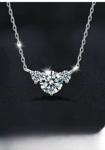 Macro detail of S925 sterling silver necklace featuring three-stone moissanite pendant