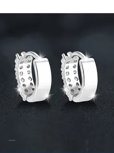 Macro shot of S925 sterling silver hoop earrings with double row moissanite inlay