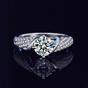 Moissanite S925 silver four-prong ring with pavé stones on a black reflective base