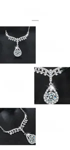 Macro detail of pear-cut moissanite pendant with six-prong setting and silver angel wings