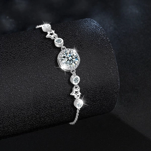 S925 silver bracelet featuring star and moissanite links on a black jewelry stand