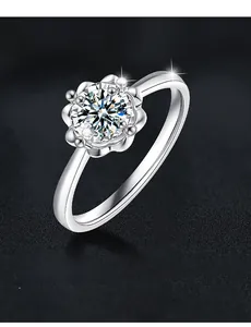 Detail of 3EX cut moissanite ring with 58 facets and sparkling flower cluster setting
