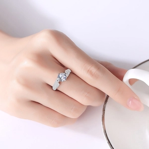 Elegant S925 sterling silver moissanite ring with four-prong setting on female model