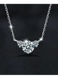 Macro shot of S925 sterling silver three-stone necklace featuring 58-facet moissanite gems