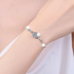 Elegant 925 sterling silver moissanite bracelet with star motifs on a woman's wrist
