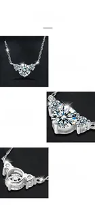 Detail view of heart moissanite pendant featuring triple-stone design and prong setting