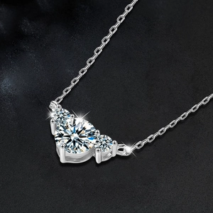 Elegant s925 silver necklace with three round-cut Moissanite stones on black background