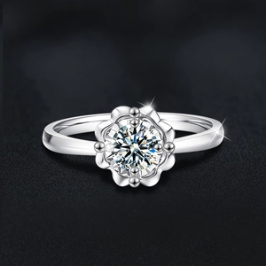 Elegant S925 sterling silver ring with floral moissanite center on a black background