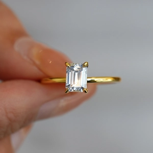 Classic emerald cut moissanite ring with four-prong 18k gold plated silver band