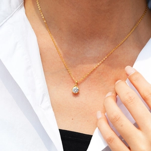 Classic 925 sterling silver snowflake necklace with moissanite pendant on a model