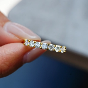 Elegant 18K gold plated S925 silver ring featuring a row of eight round sparkling moissanites